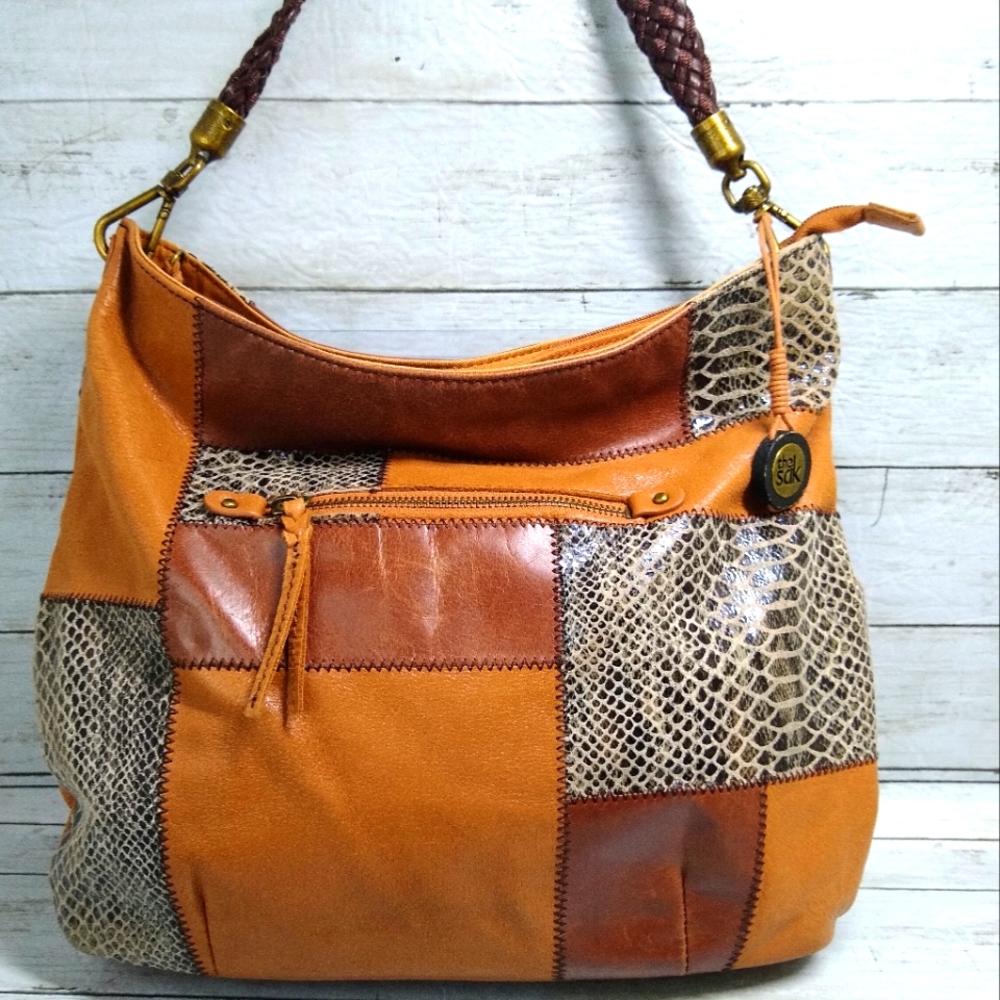 The SAK Lrg Brown Lthr Patchwork Boho Zip Multi-Pocket Woven Strap Shoulder Bag